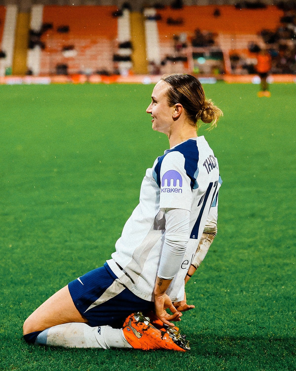 Martha Thomas knee slides in celebration.