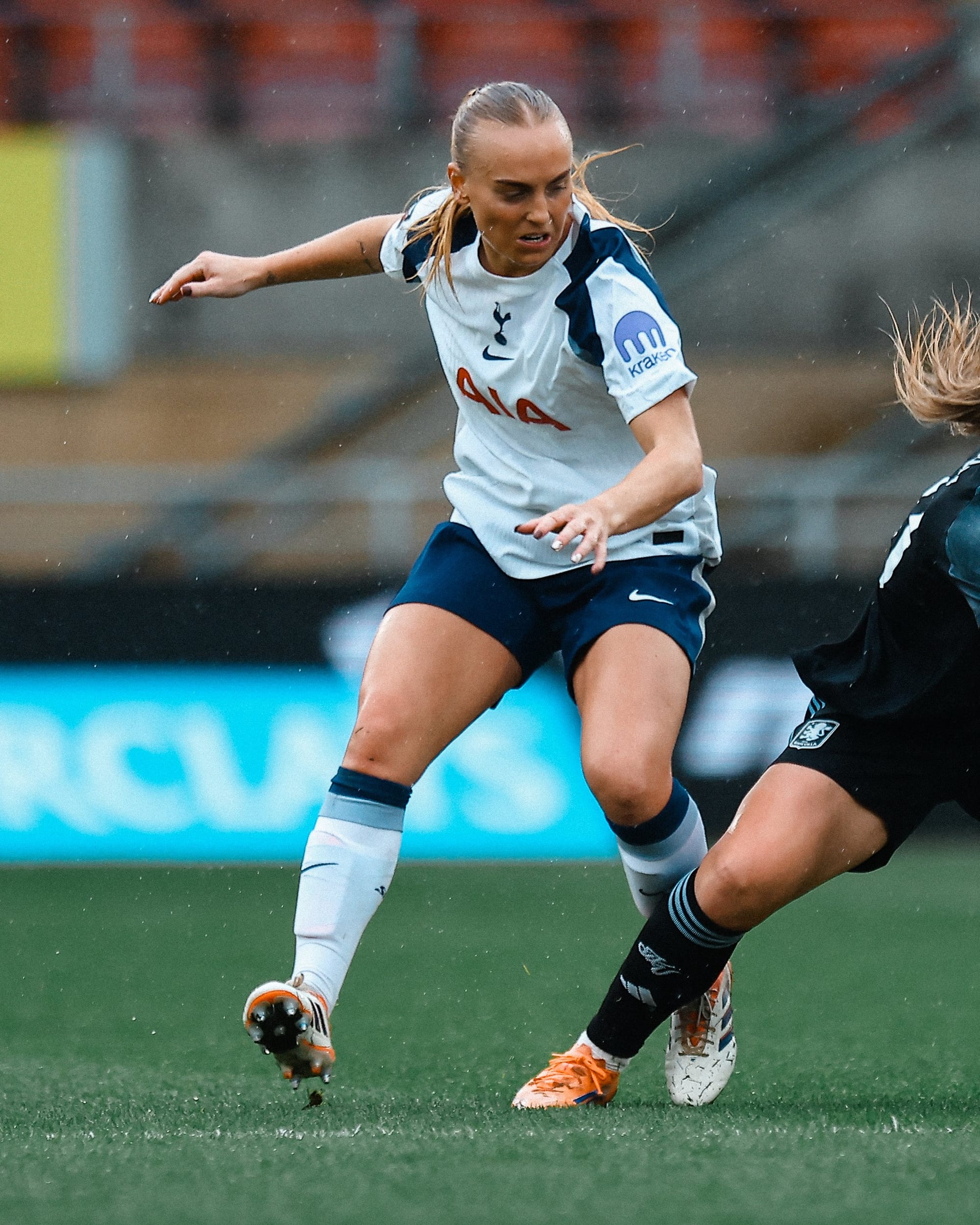 Molly Bartrip challenges an Aston Villa player.