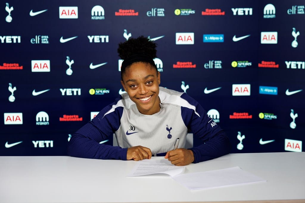Araya Dennis signs her new contract.
