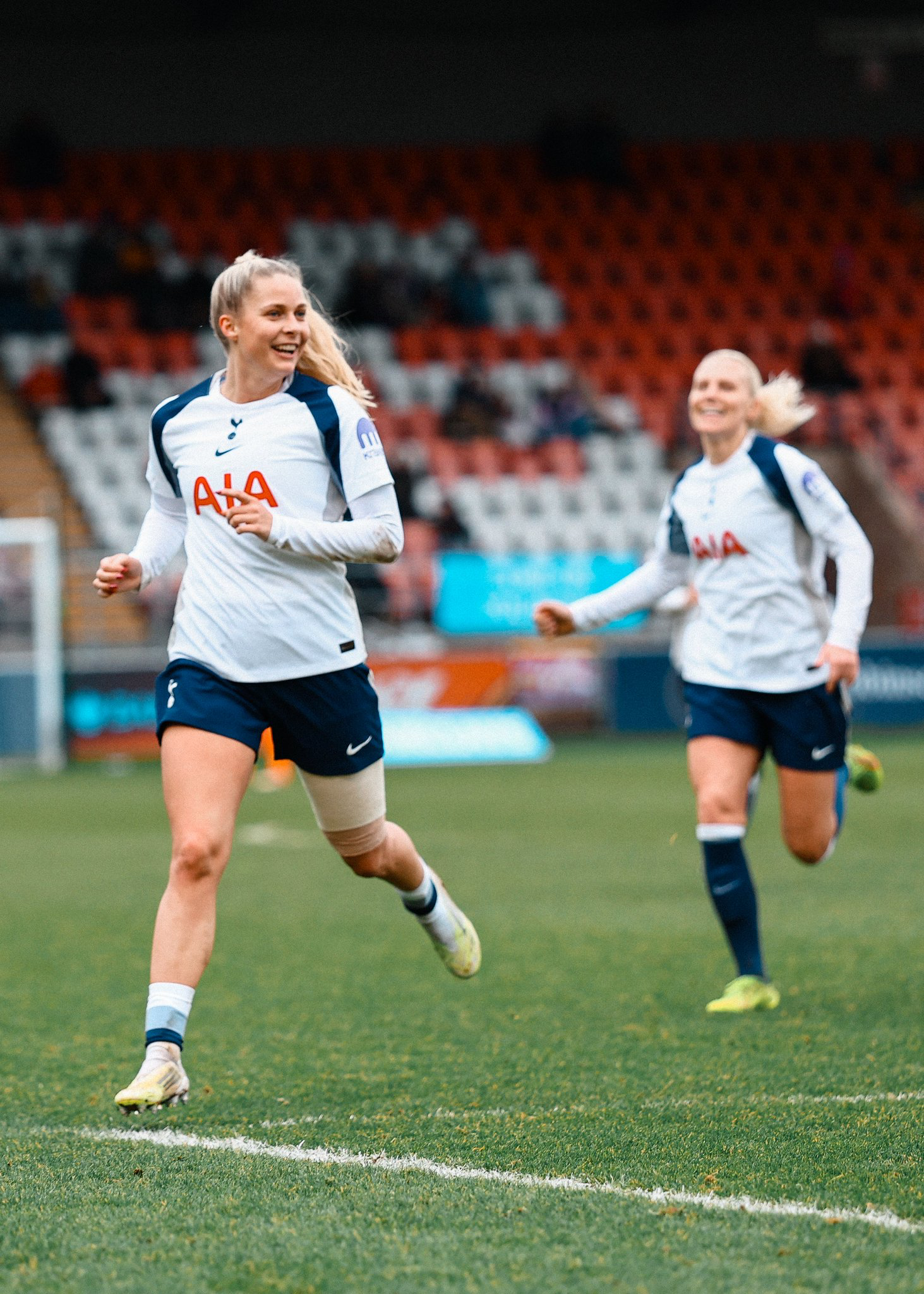 Olivia Holdt smiles after scoring, Josefine Rybrink running up behind her.