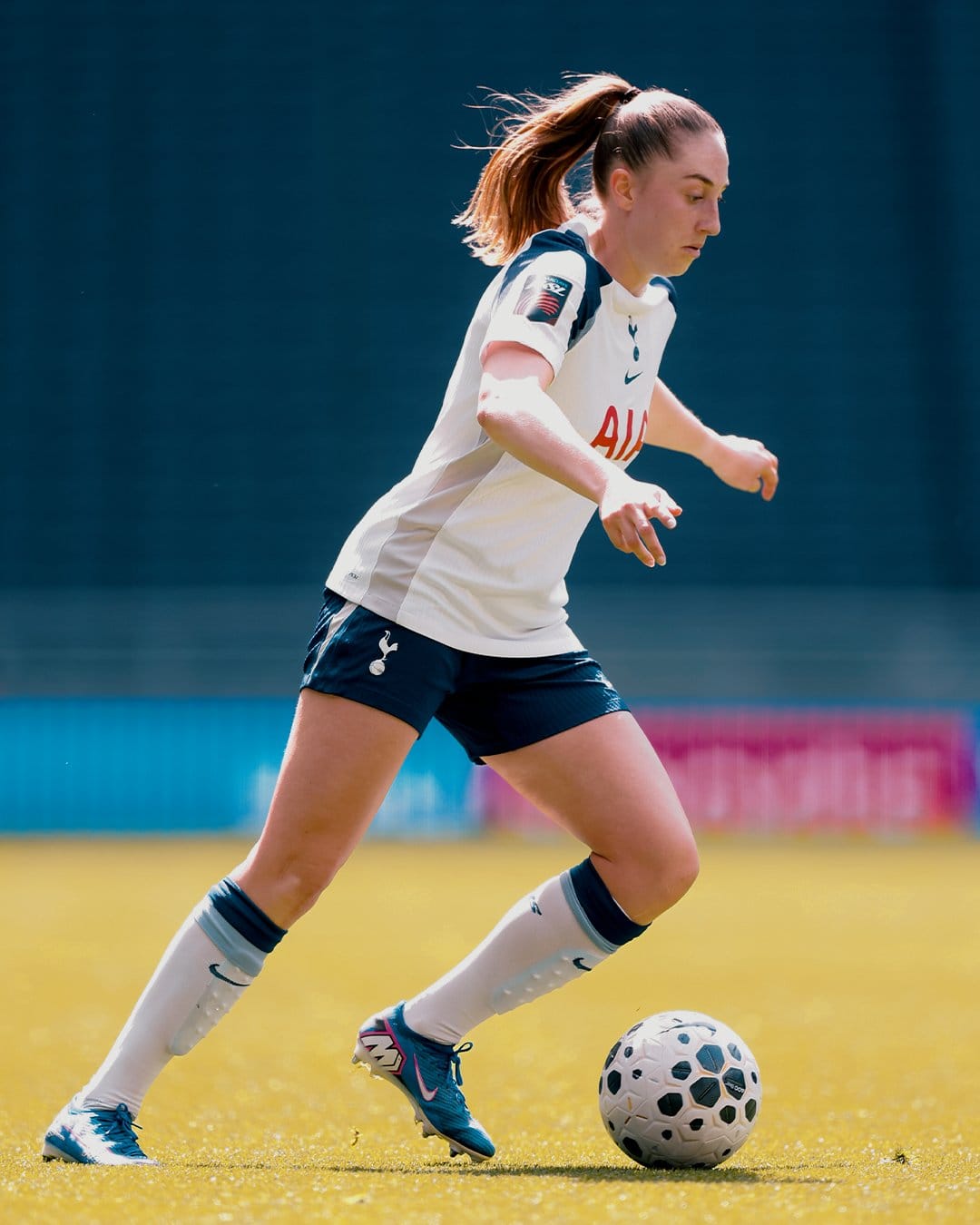 Ella Morris dribbles the ball. 