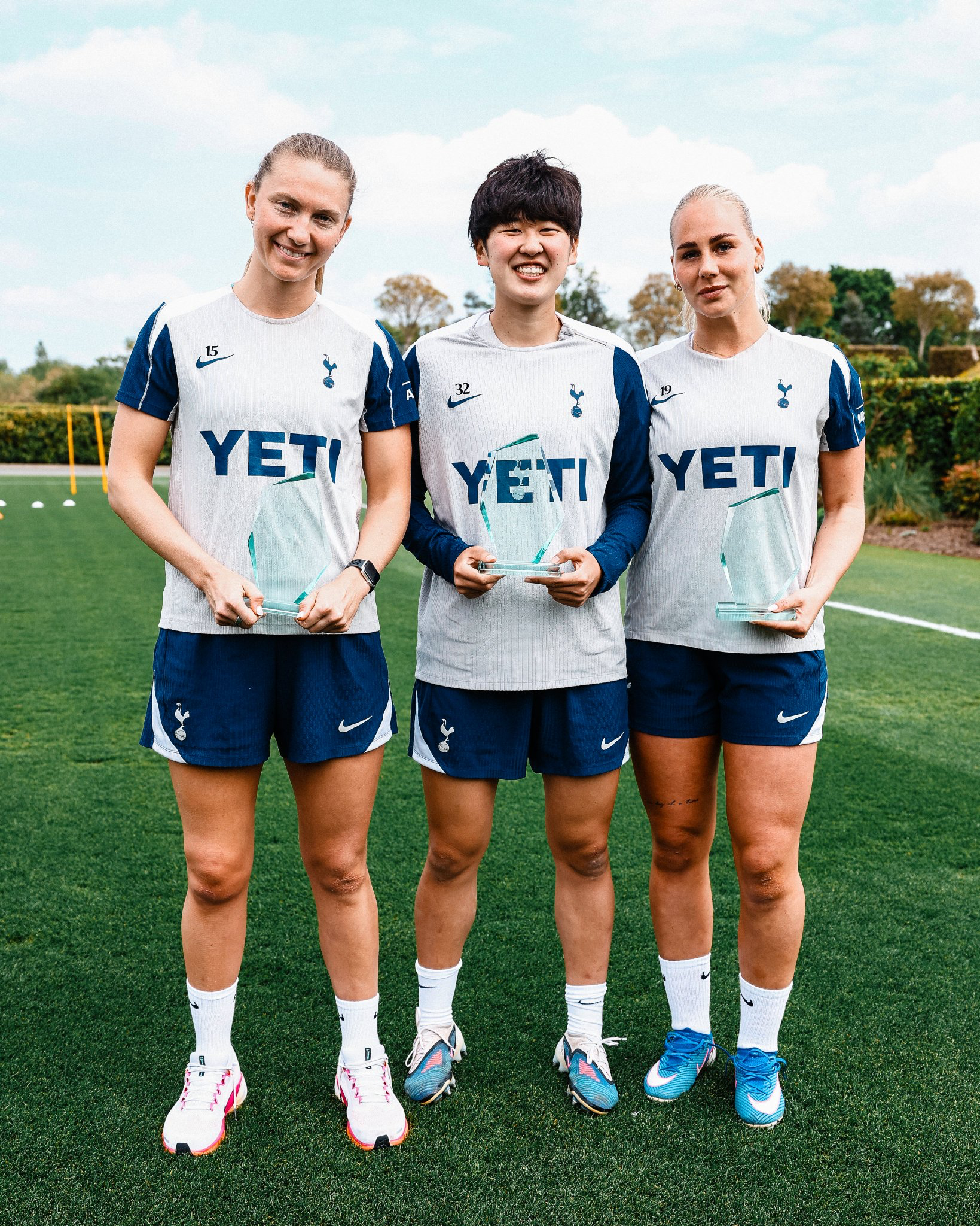 Clare Hunt, Tōko Koga, and Cathinka Tandberg pose together with their end-of-season awards.