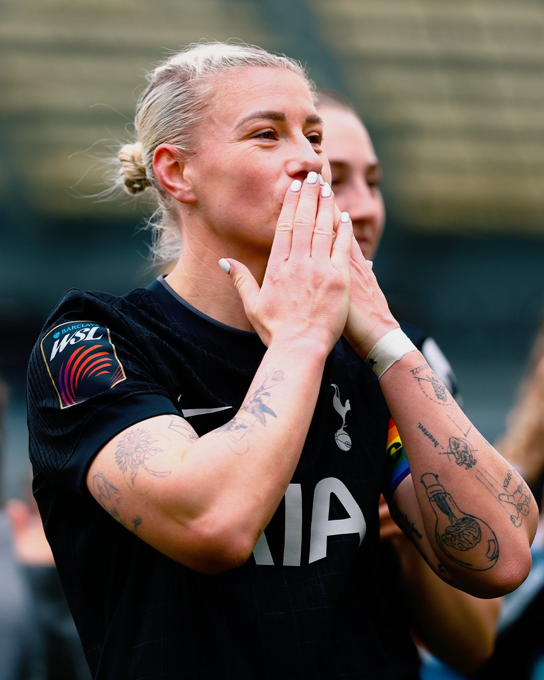 Beth England blows a kiss to the fans.