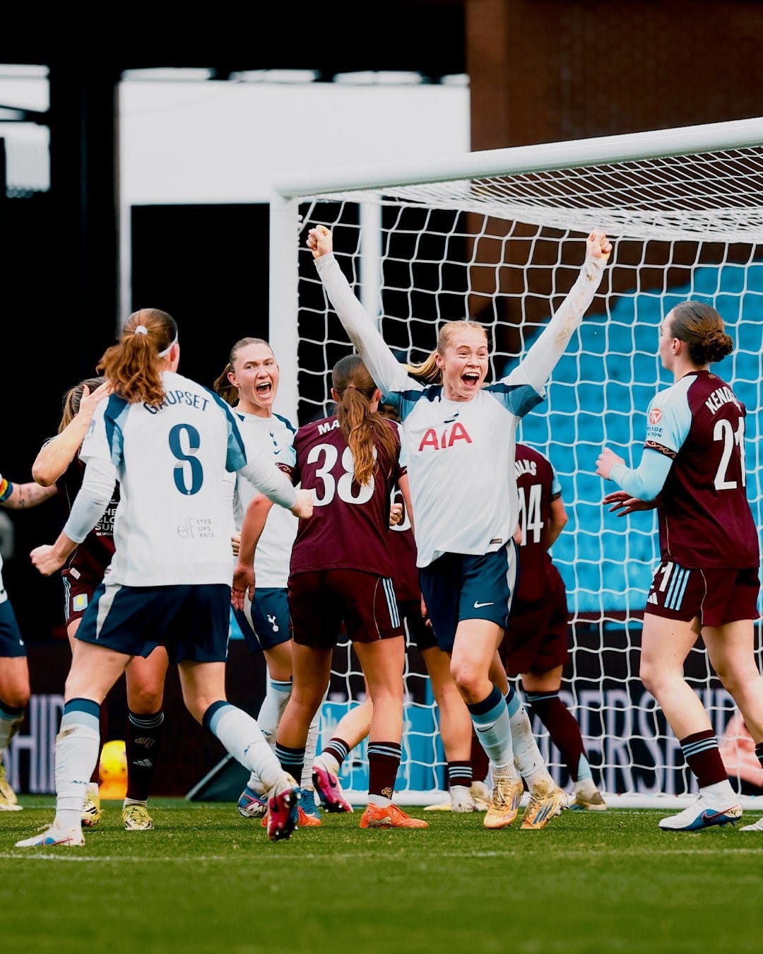 Julie Blakstad holds her hands up after scoring.
