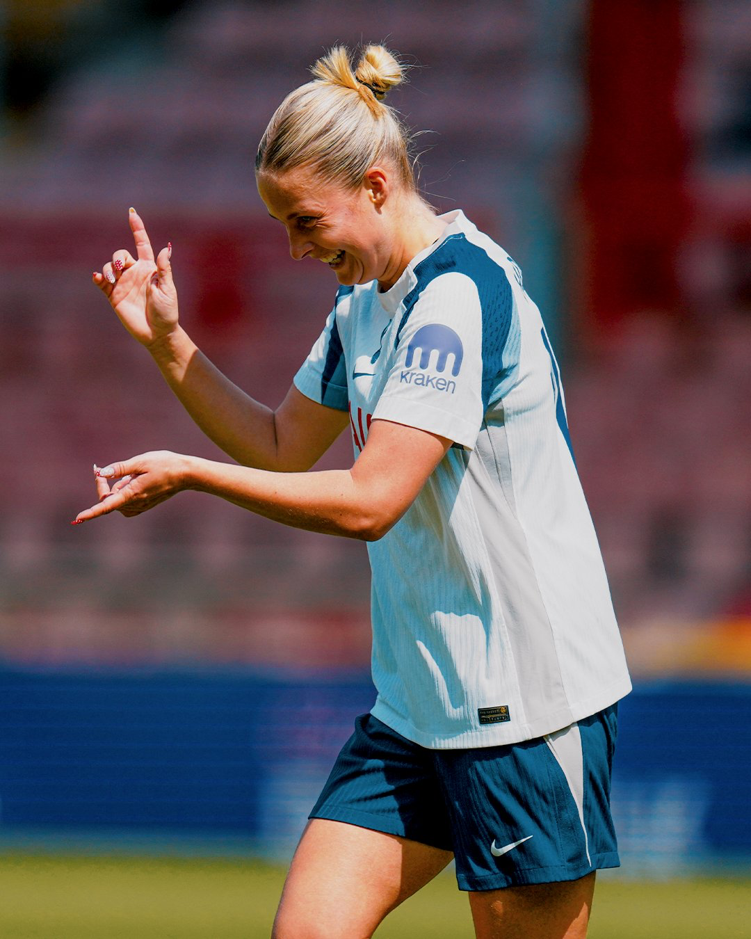 Olivia Holdt appears to be doing some sort of finger guns celebration after scoring.