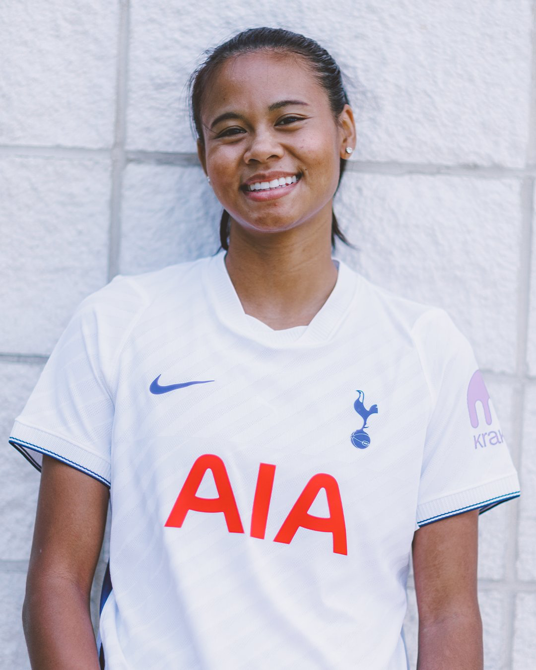 Alice Sombath smiles in her new Spurs shirt.