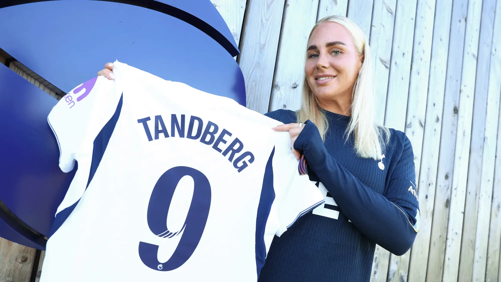 Cathinka Tandberg holds up her new #9 shirt.
