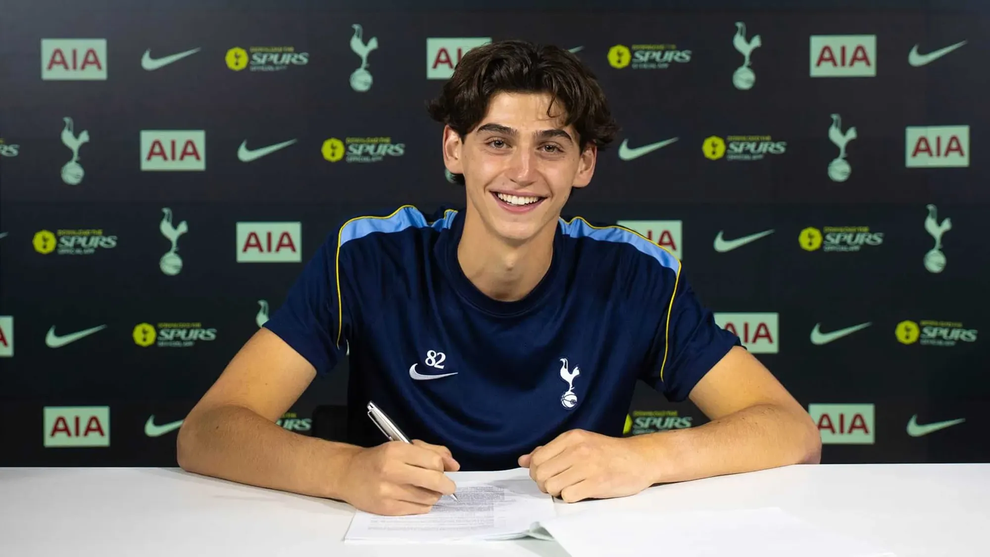Blake Irow signs his new contract.