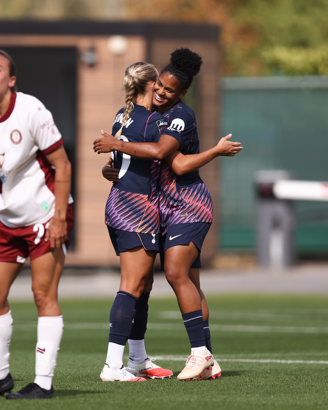 Olga Ahtinen (I think??) and Shekiera Martinez hug.
