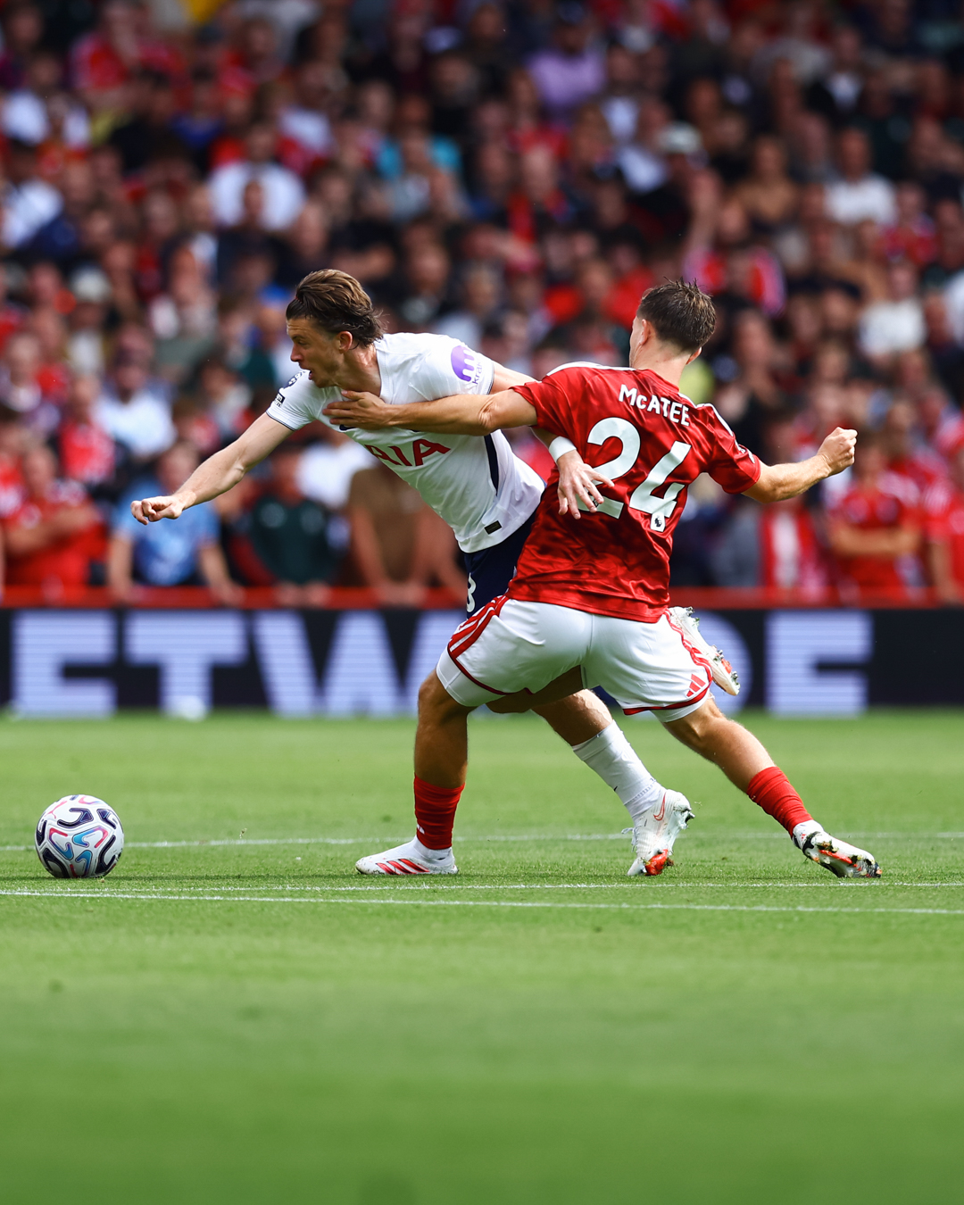 Conor Gallagher challenges James McAtee for the ball.