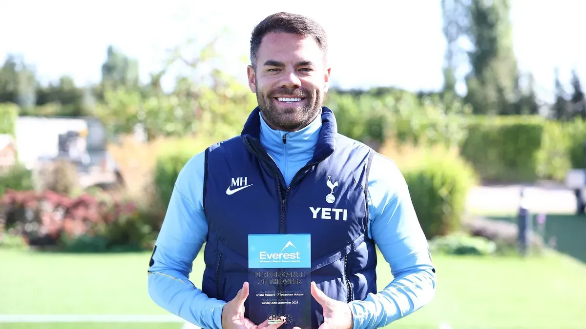 Martin Ho holds up his award.