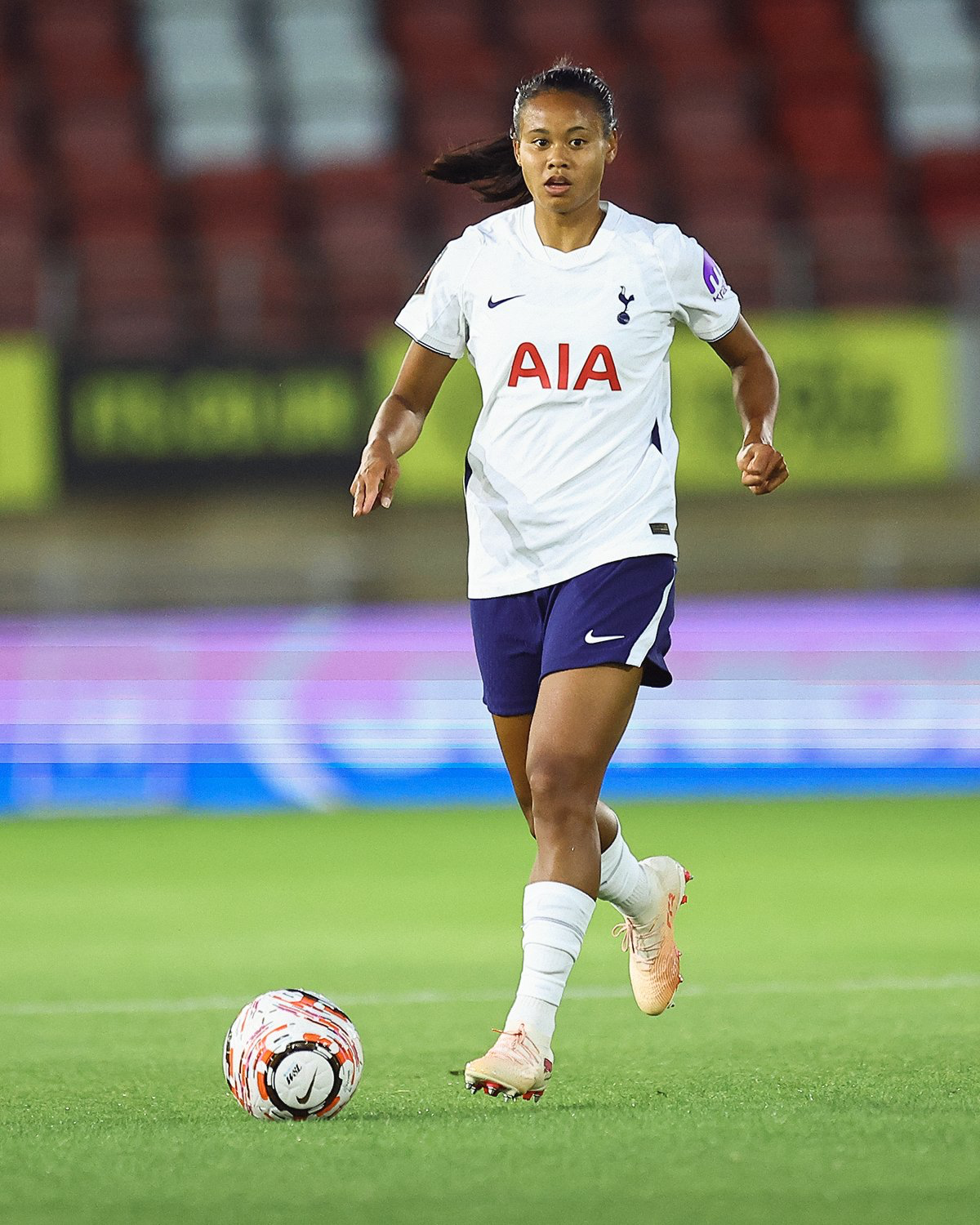 Alice Sombath looks ahead as she dribbles the ball.