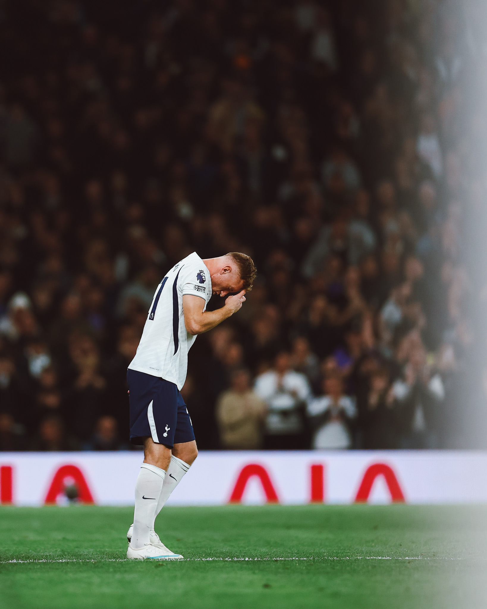 Dejan Kulusevski prays on the pitch.