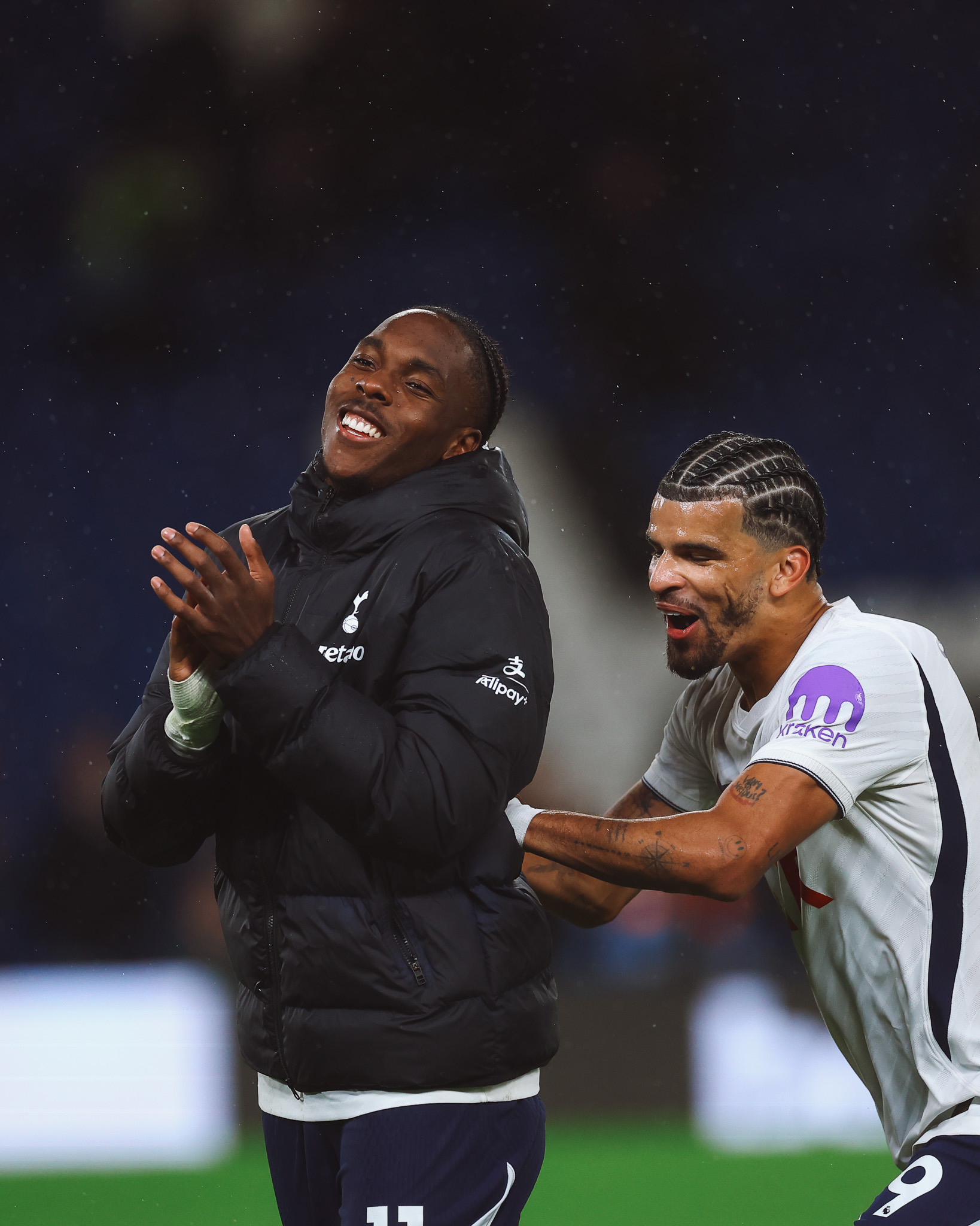 Mathys Tel smiles after the game, Dominic Solanke encouraging him to go to the away fans.