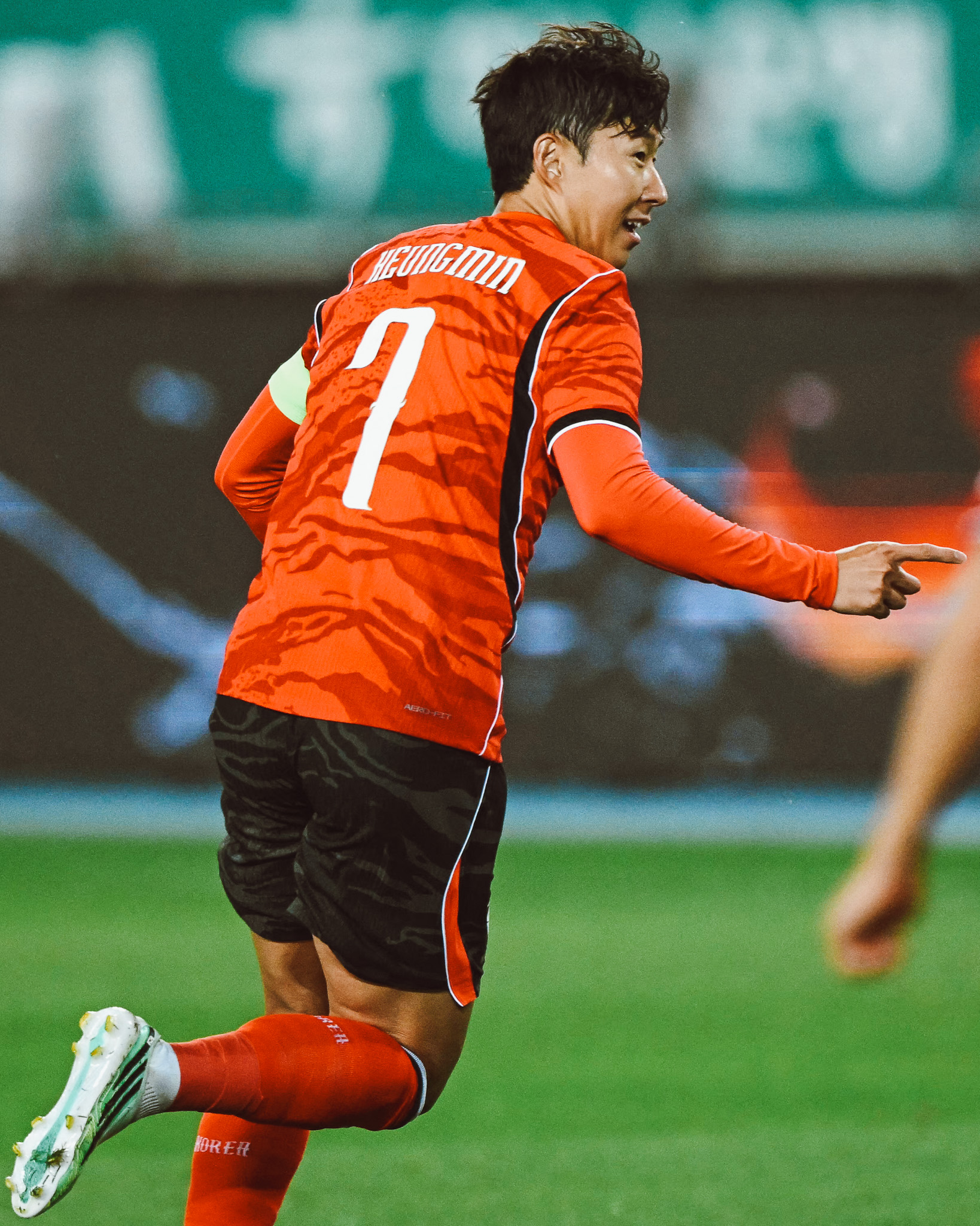 Son Heung-min points after scoring a goal.