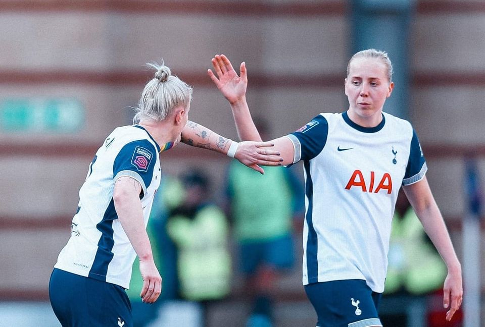 Eveliina Summanen holds out her hand to high-five Beth England.