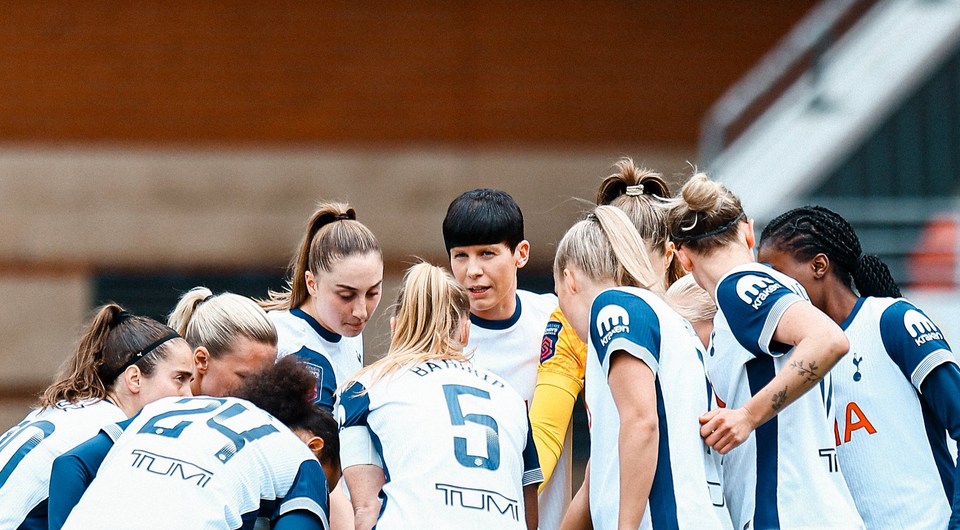 Ash Neville speaks durin the pre-game huddle.