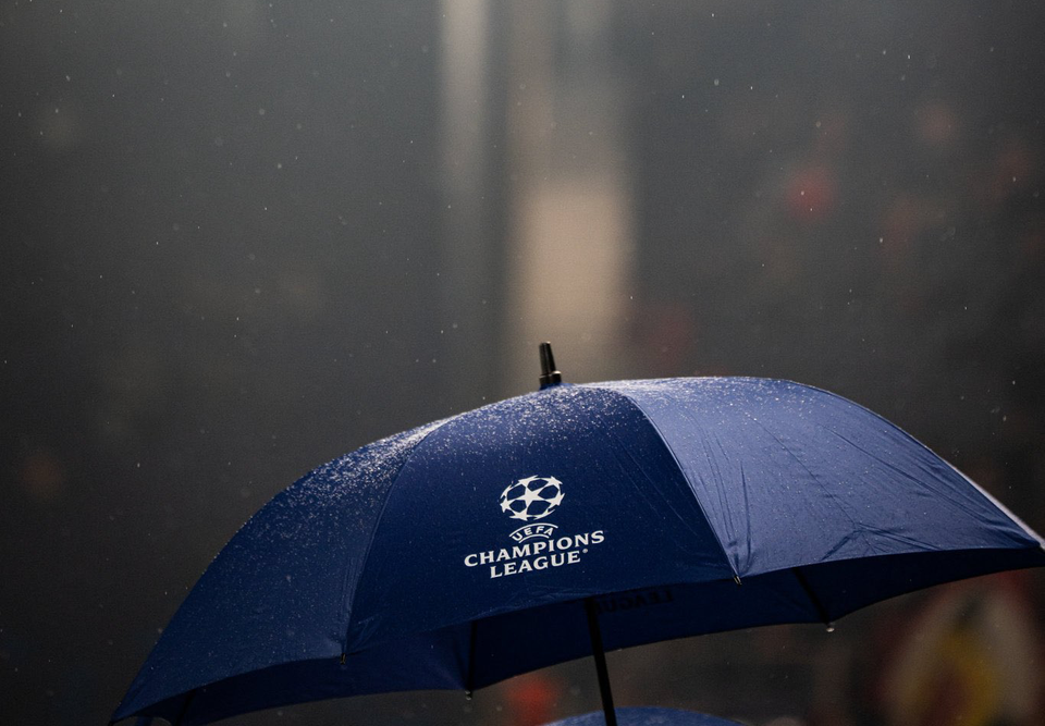 A Champions League-branded umbrella in the rain. 