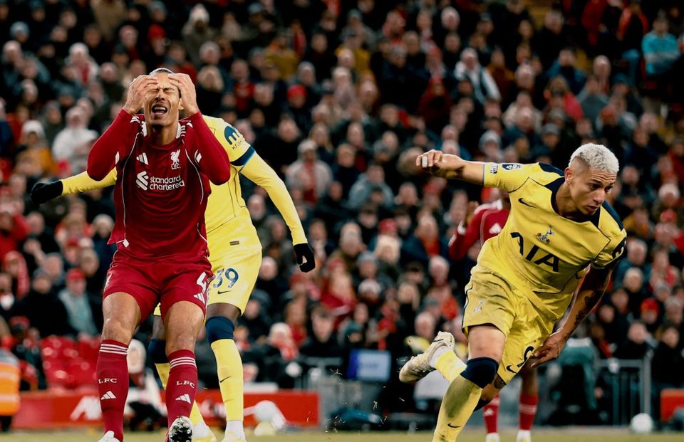 Richarlison wheels away in celebration as Virgil van Dijk reacts in frustration.