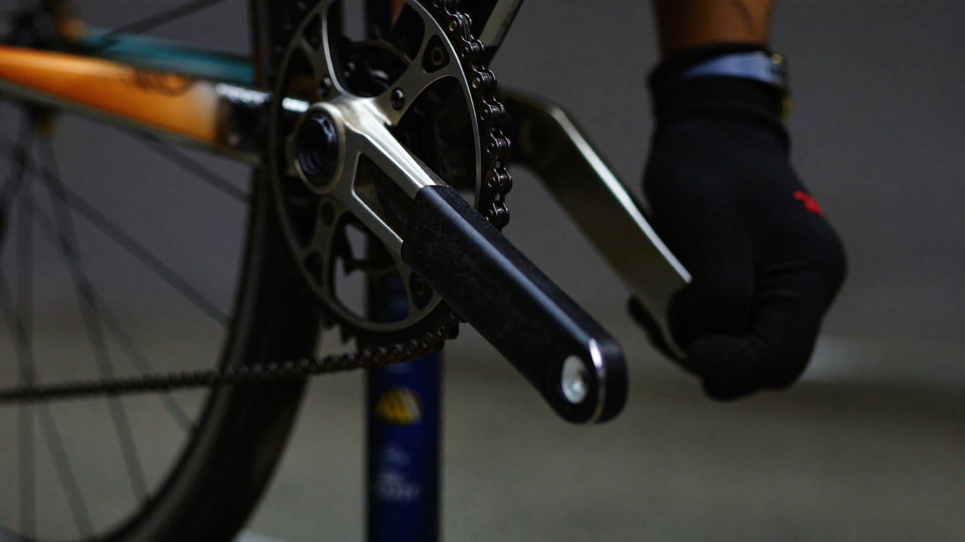 Close-up of a road bike crankset with a power-meter pod