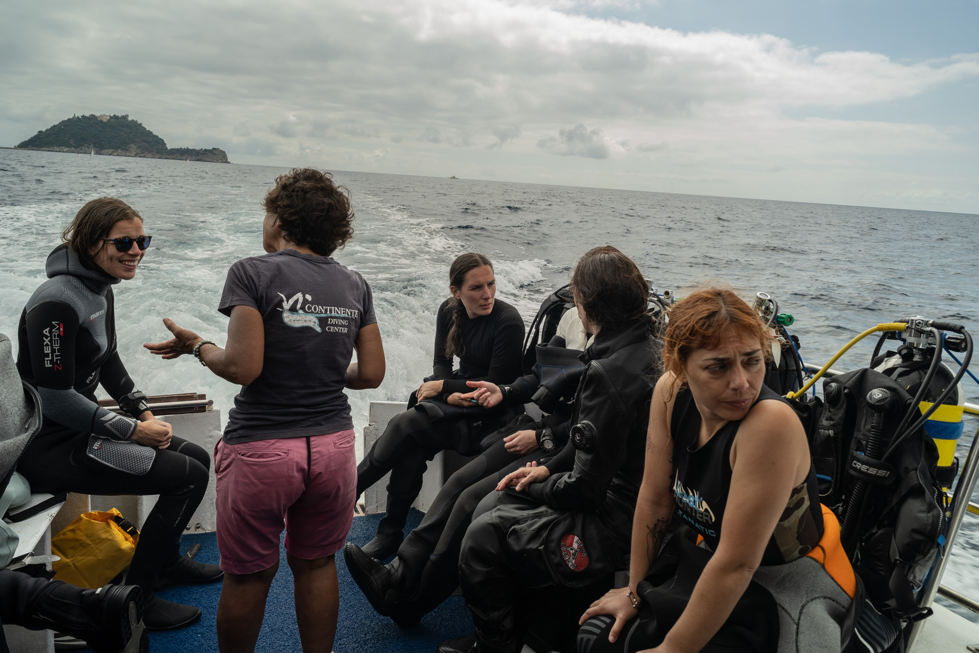 Valentina Di Miccoli from Greenpeace (in the foreground) and marine biologists from DISTAV—the Department of Earth, Environmental, and Life Sciences at the University of Genoa—prepare for a seabed monitoring mission around the island of Gallinara (Savona) on June 27, 2024.