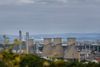 Article headline: FFS explains: why Grangemouth shut – and what happens next Image description: Cooling towers and chimneys o