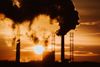 Article: 'Licence to pollute'? Prosecutions of environmental rule-breakers plummet Image description: pollution smoke at suns