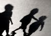 Headline: 'Neo-Nazi' group condemned for using children in by-election campaign Image description: Blurry shadows of three bo