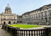 Article headline: Edinburgh uni boss pressured over outside earnings as job losses mount Image description: The Old College q