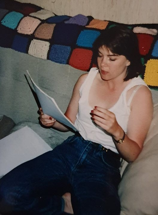 Stephanie reading a course syllabus and an investigation report