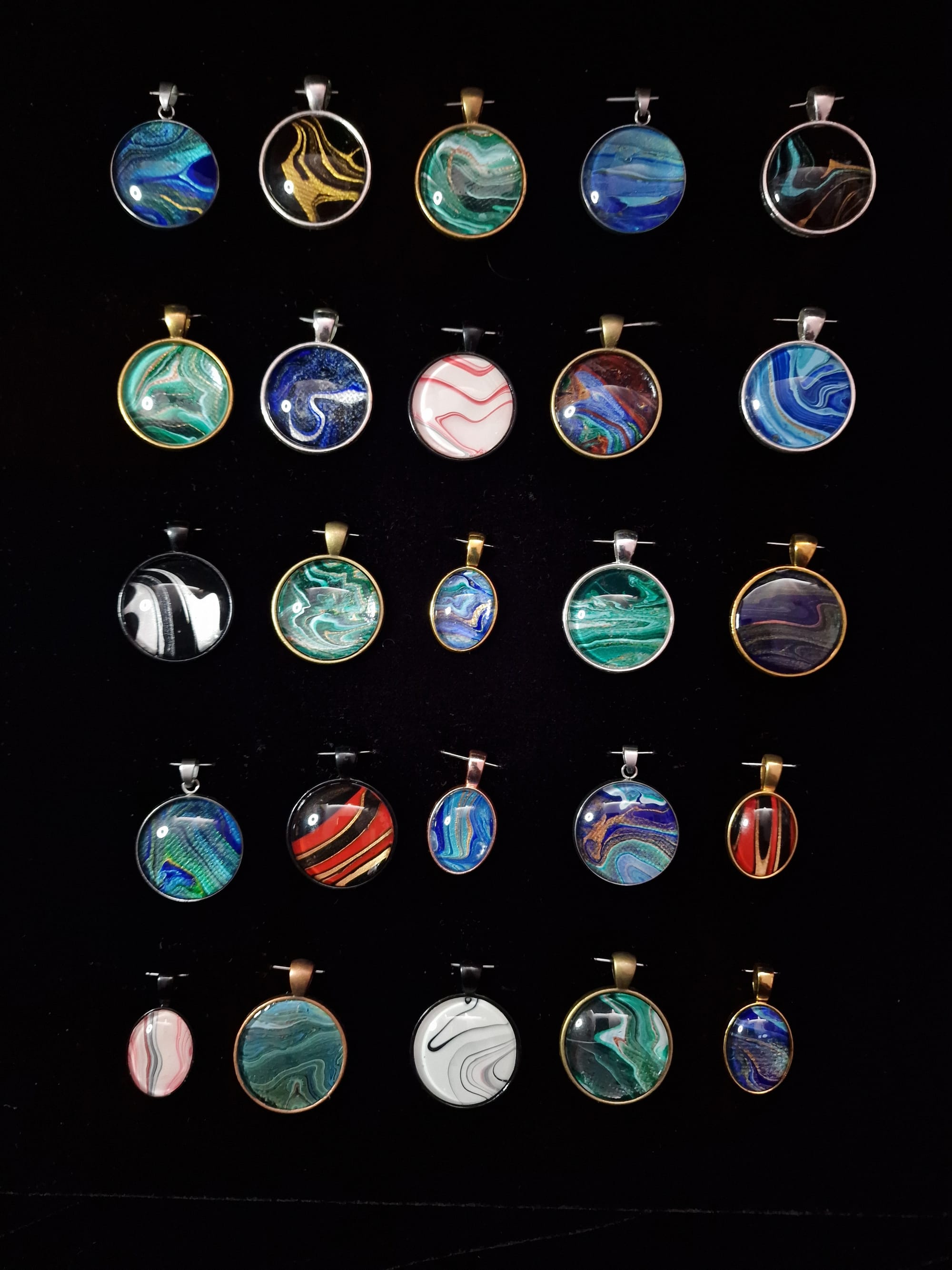 Some of the pendants that will be on sale in the art show 'print shop'