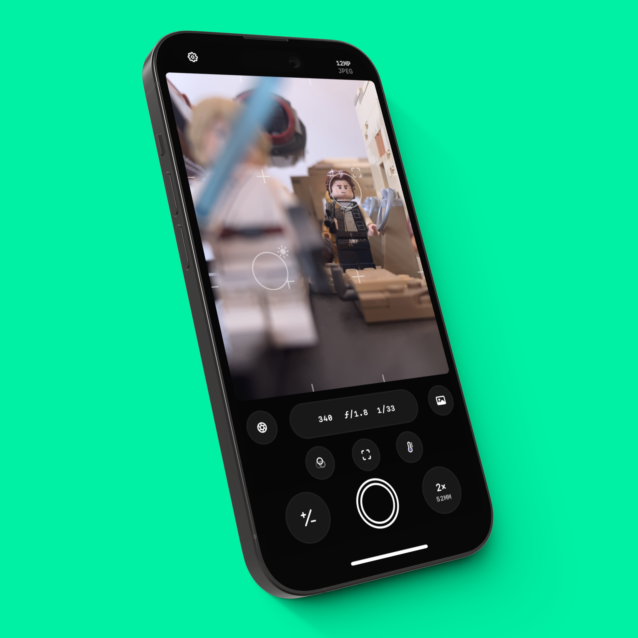 An iPhone 14 Pro showing Obscura’s Camera interface and the Dual Reticules over a bright green background.