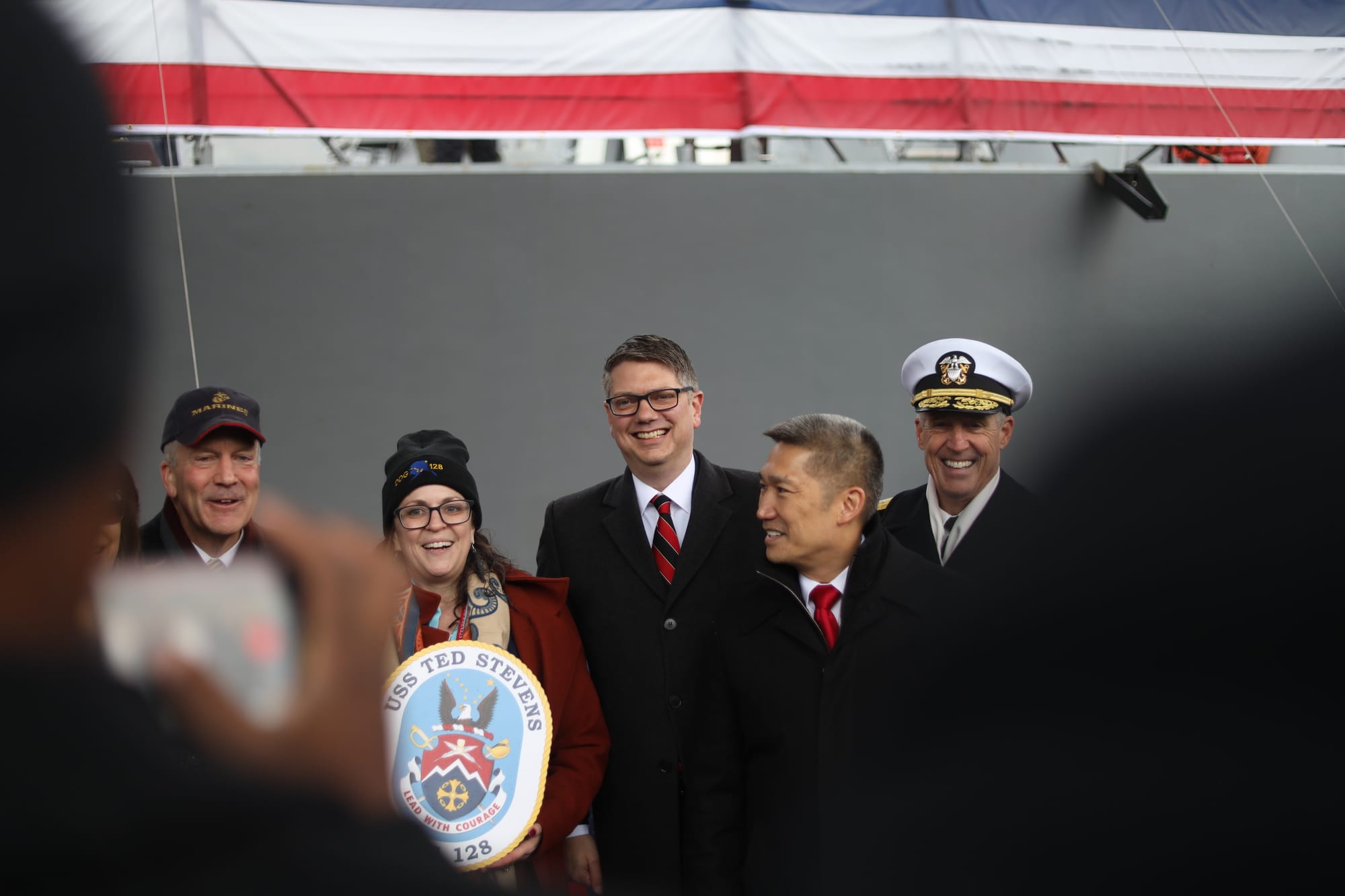 U.S. Rep. Nick Begich III, center, poses for a photo at a warship's commissioning ceremony in Whittier, Alaska, earlier this month. (Nathaniel Herz/Anchorage Press)