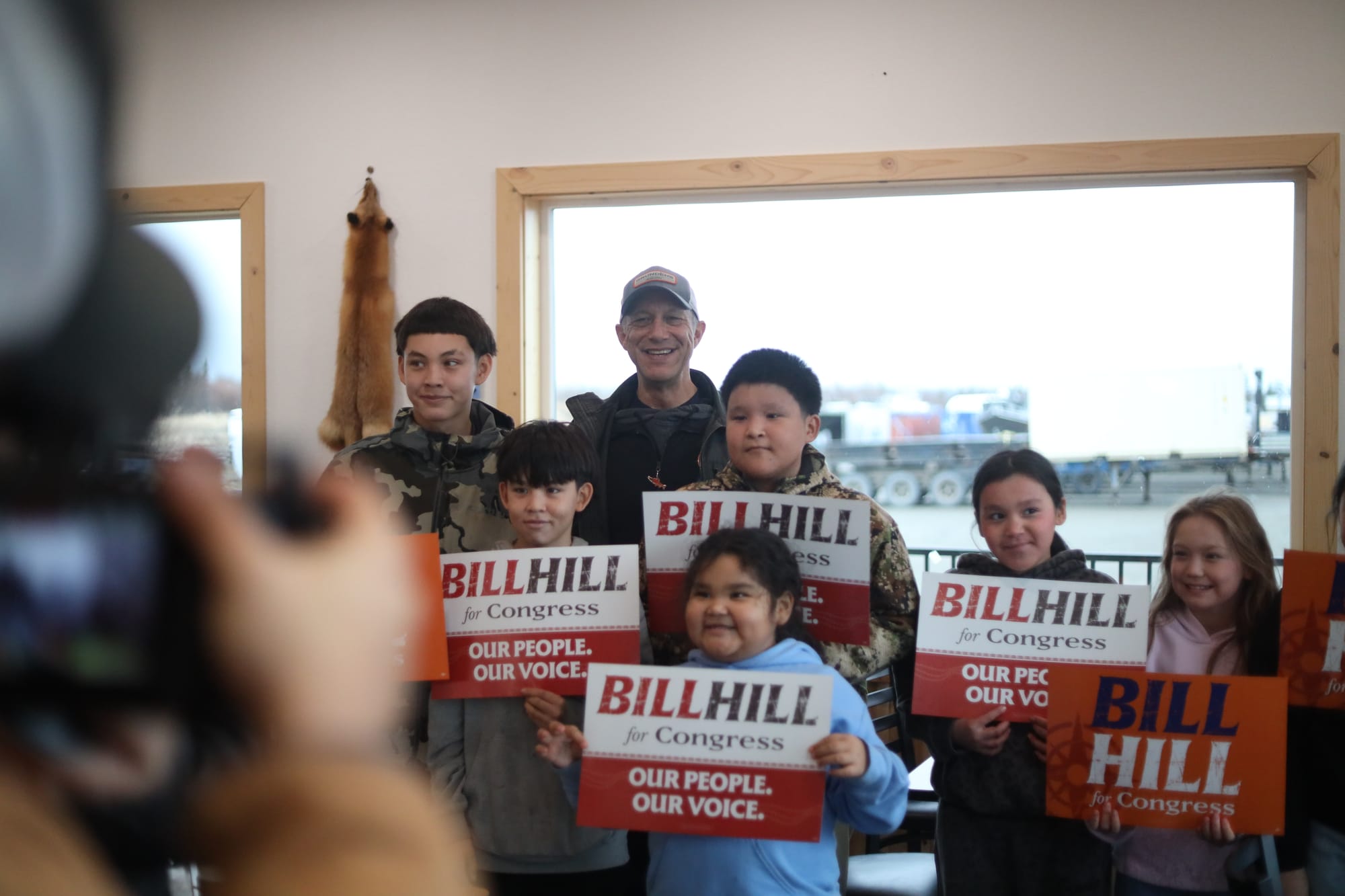 Hill poses for a photo in Iliamna. (Nathaniel Herz/Anchorage Press)