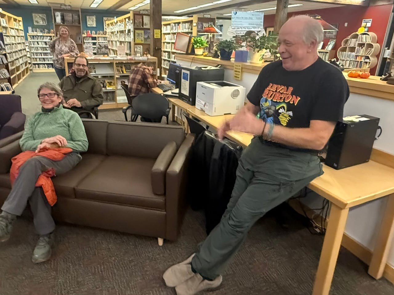 Ron Clarke laughs with friends and supporters at a watch party at the Sutton Public LIbrary. (Matt Tunseth)