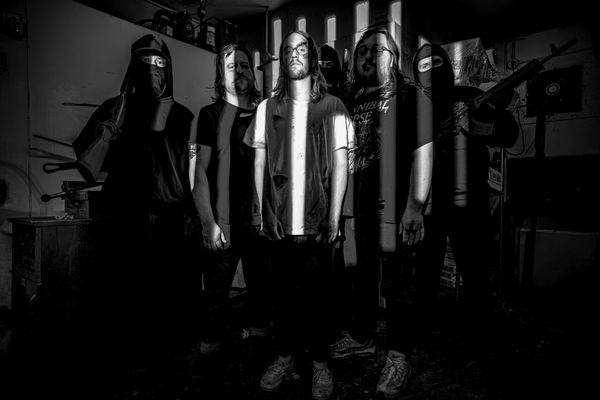 The band Pains poses for a photo during their music video shoot for Shrapnel Dispersion.