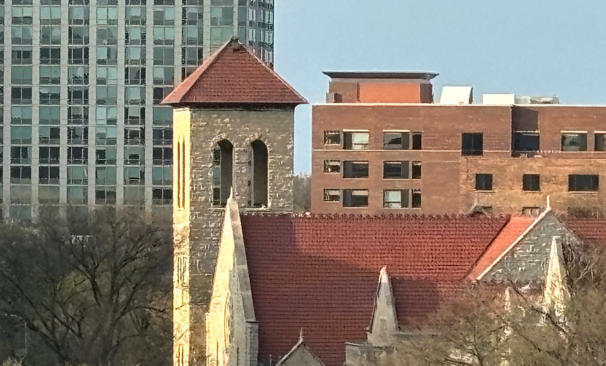 Downtown Evanston building in a backdrop to a church belltower.