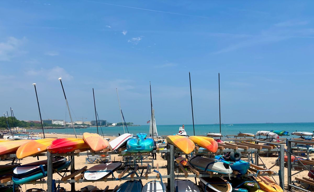 Kayaks stacked on racks on a beach in Evanston.