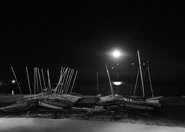 Evanston lakefront with sailboats in moonlight