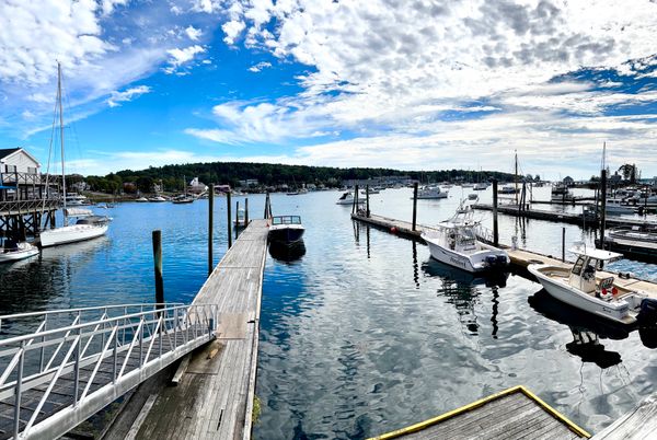 View of boats, water and sky in Boothbay, Maine.