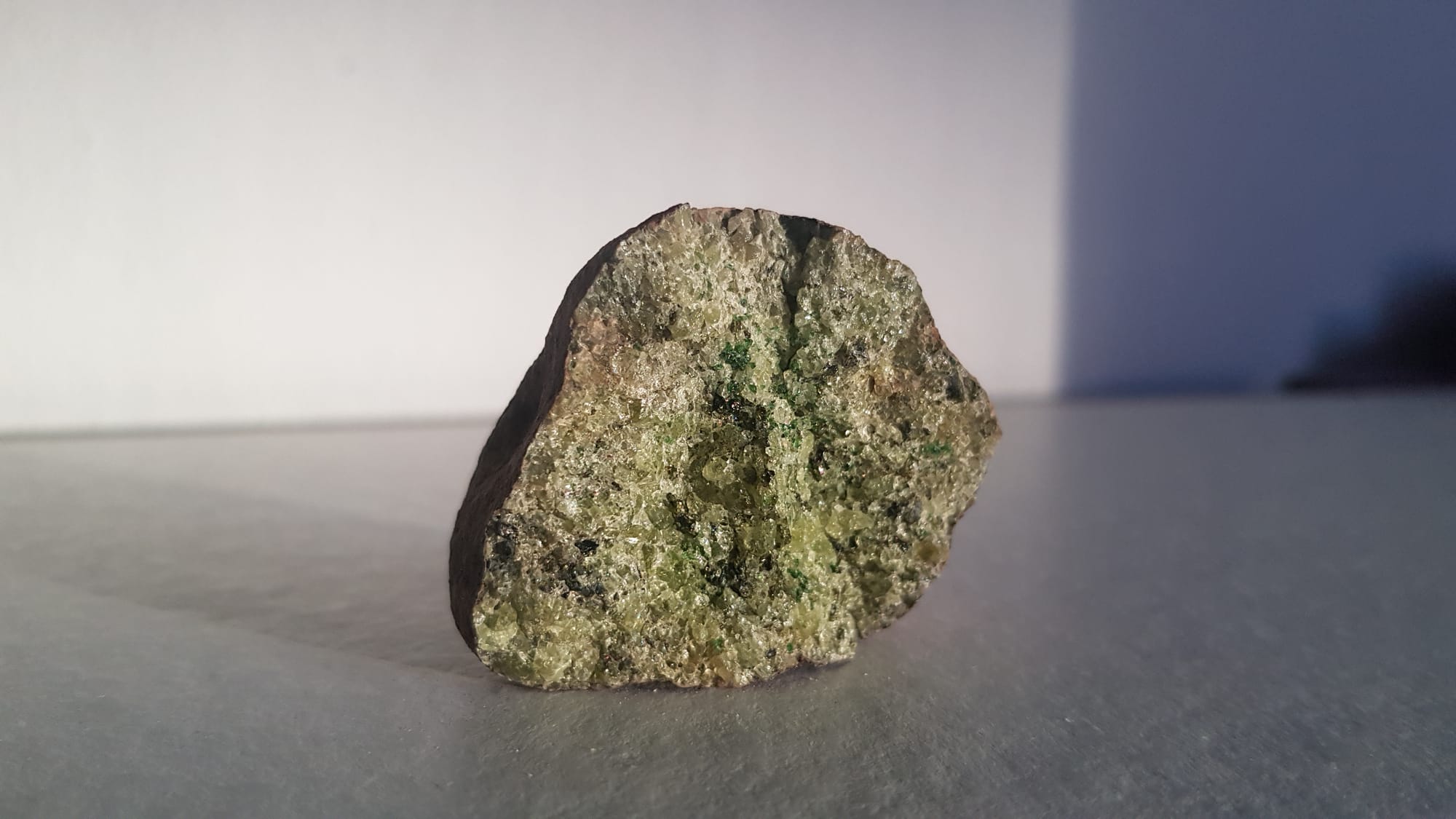 A green rock made up of olivine