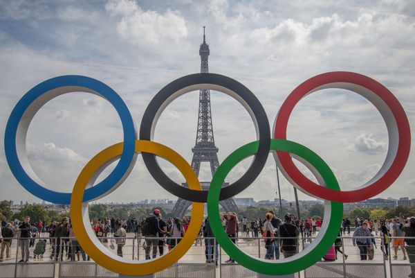 The five Olympic rings on display in front of the Eiffel Tower in Paris