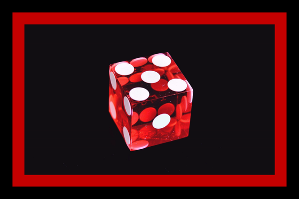Red dice on black background