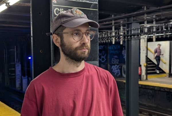 Photo of Jack Klein, founder of NewYorkLab standing on a subway platform in Brooklyn, NY.