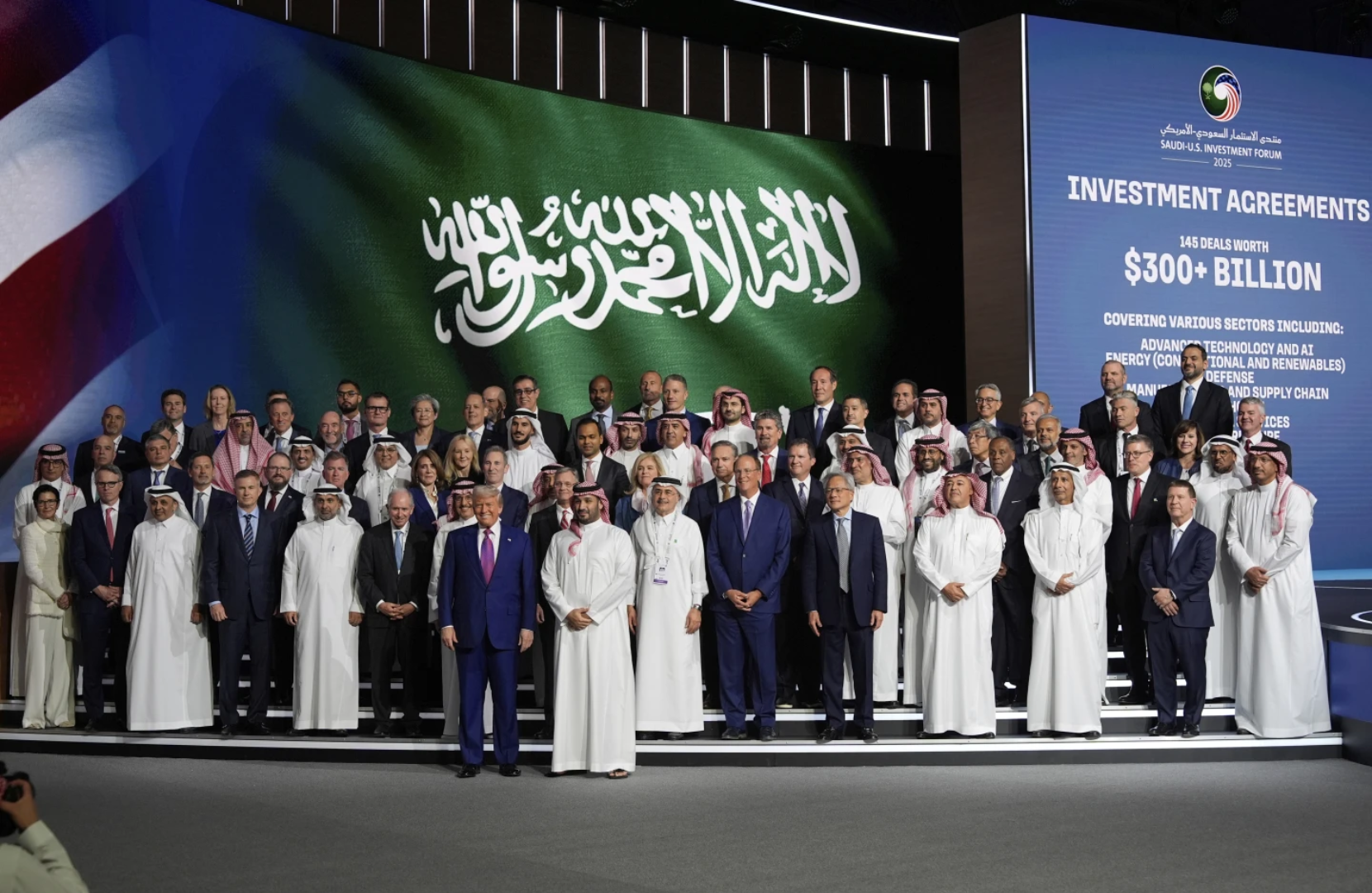 Donald Trump and Crown Prince Mohammed bin Salman pose with delegates at the Saudi-U.S. Investment Forum in Riyadh on May 13, 2025, highlighting $300B in bilateral deals.