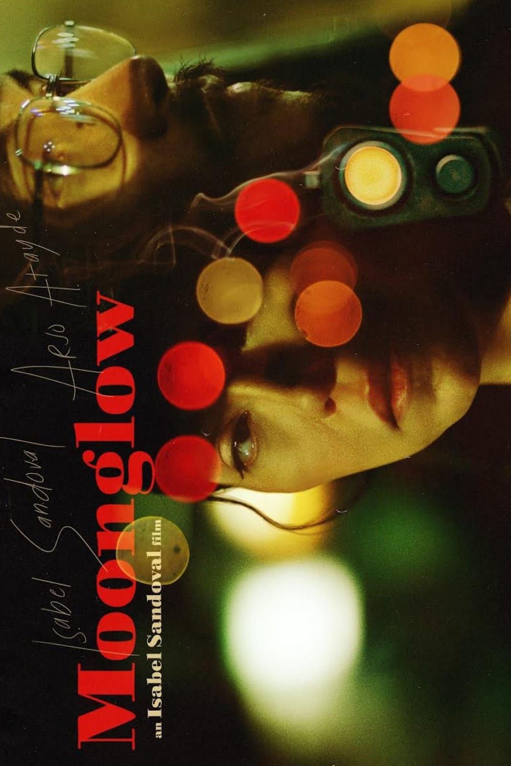A woman lying down lit by warm bokeh lights on the poster for Isabel Sandoval's neo-noir Moonglow