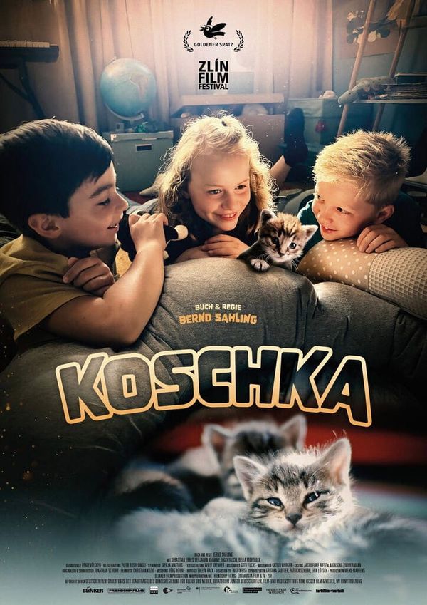 Three children and a kitten on the poster for Bernd Sahling's children's film Koschka