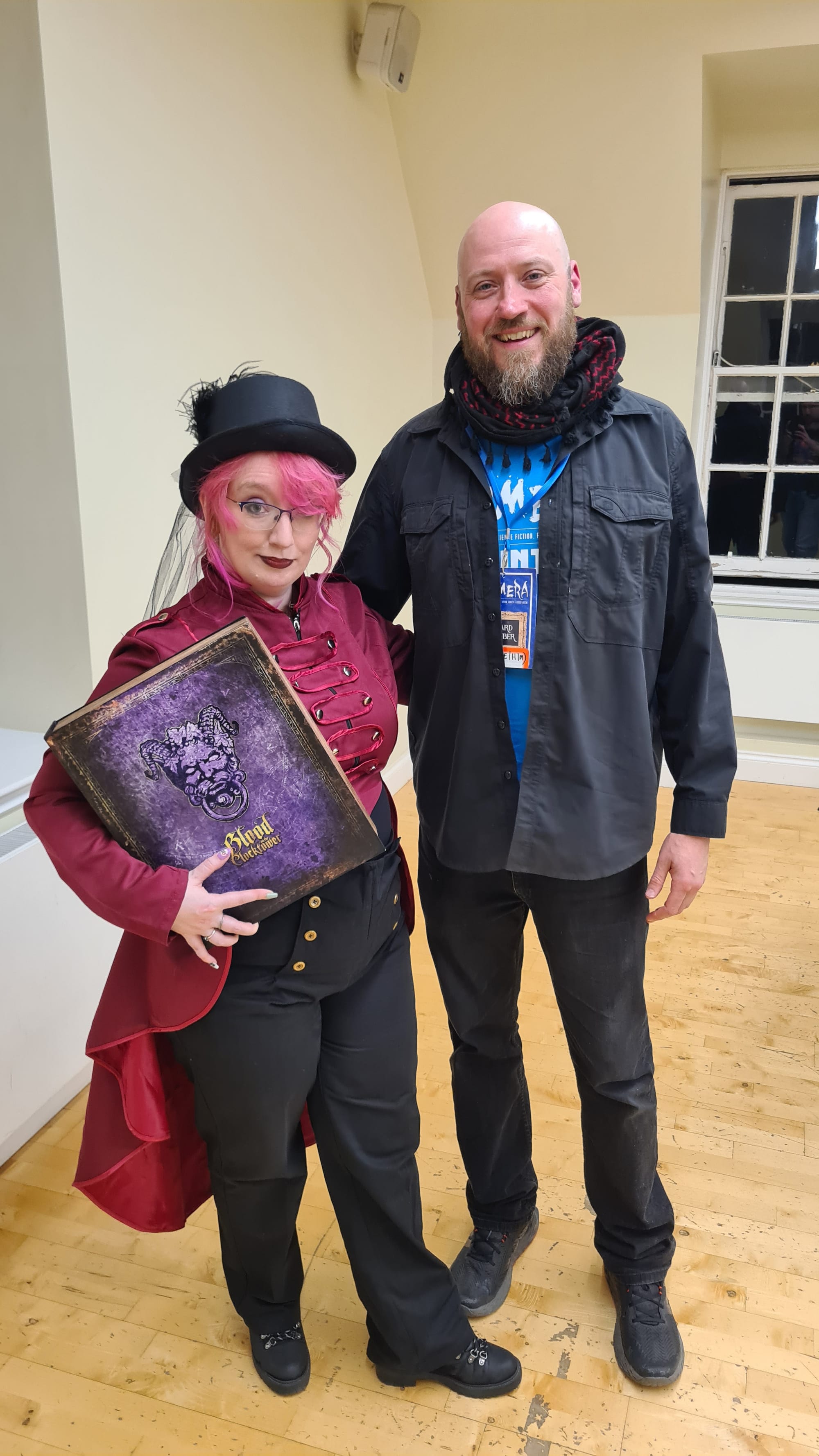 Lady dressed as Blood on the Clocktower ringmaster and man in civilian clothes!