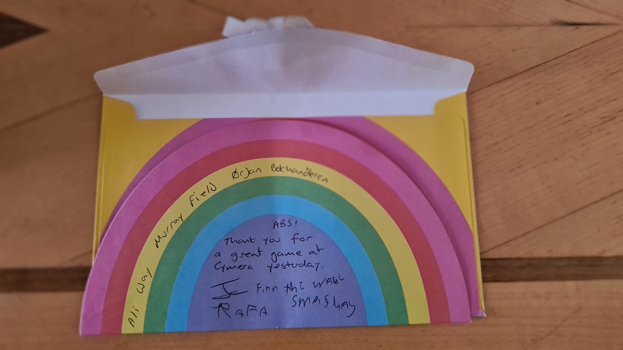 Rainbow thank you card with handwriting and some unusual names handwritten on it