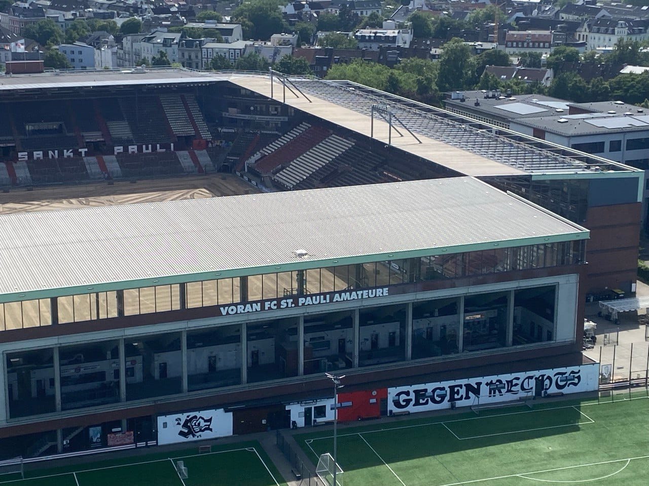 Zoomed-in shot of the mural on the side of FC St. Pauli stadium as viewed from the bunker: on the left, a fist smashes a swastika; on the right, the words "GEGEN RECHTS": "against the far-right"